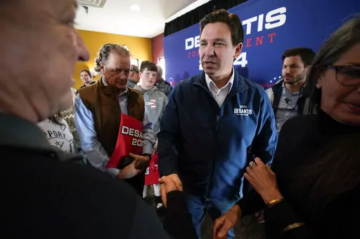 Republican presidential candidate Florida Gov. Ron DeSantis talks with audience members during a meet and greet, Friday, Nov. 3, 2023, in Denison, Iowa. Former President Donald Trump was the first choice of 51% of likely Iowa caucus participants in a Des Moines Register-NBC News-Mediacom Iowa Poll published Monday, Dec. 11. Florida Gov. Ron DeSantis, who has vowed that he will win Iowa, had the support of 19%. (AP Photo/Charlie Neibergall, File)
