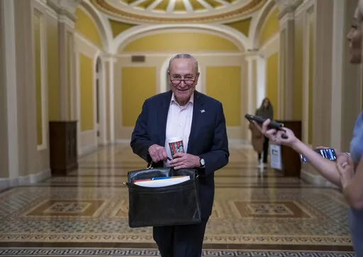 Senate Majority Leader Chuck Schumer, D-N.Y., returns to the Capitol in Washington, on the morning after Election Day Nov. 9, 2022. (AP Photo/J. Scott Applewhite, File)
