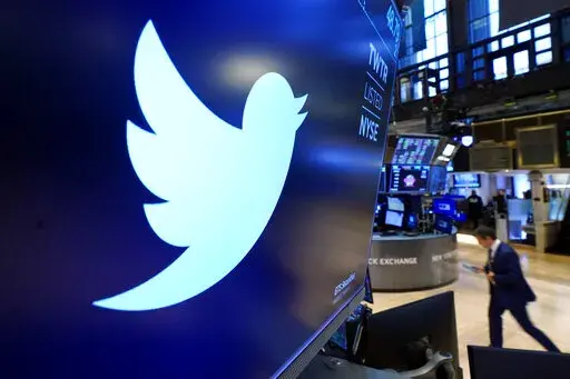 The logo for Twitter appears above a trading post on the floor of the New York Stock Exchange, Nov. 29, 2021. Startling new revelations from Twitter's former head of security, Peiter Zatko, have raised serious new questions about the security of the platform's service, its ability to identify and remove fake accounts, and the truthfulness of its statements to users, shareholders and federal regulators. (AP Photo/Richard Drew, File)