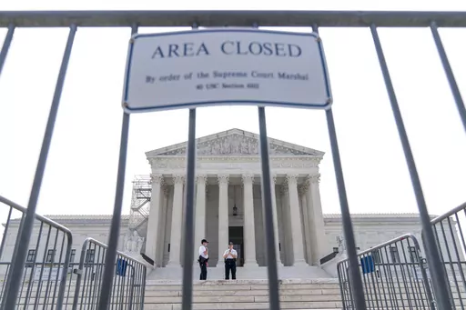Security works on the steps of the Supreme Court, Friday, June 30, 2023, as decisions are expected in Washington. A year after its sweeping gun rights ruling, the Supreme Court has agreed to decide whether judges are going too far in striking down restrictions on firearms. The justices said Friday they will hear the Biden administration’s appeal of one such ruling that struck down as unconstitutional a federal law meant to keep guns away from people who have domestic violence restraining order