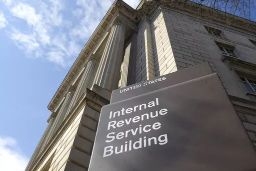 In this March 22, 2013, photo, the exterior of the Internal Revenue Service (IRS) building is seen in Washington. The IRS is announcing plans to hire 10,000 new workers to help reduce a massive backlog that the Biden administration says will make this tax season the most challenging in history. (AP Photo/Susan Walsh, File)