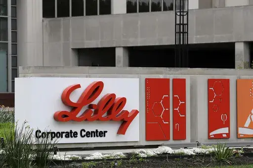 A sign for Eli Lilly & Co. sits outside their corporate headquarters in Indianapolis on April 26, 2017. The company said Wednesday, May 3, 2023, that its experimental Alzheimer’s drug appeared to slow worsening of the mind-robbing disease in a large study. (AP Photo/Darron Cummings, File)