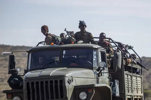 Ethiopian government soldiers ride in the back of a truck on a road near Agula, north of Mekele, in the Tigray region of northern Ethiopia on May 8, 2021. Authorities in Ethiopia's northern Tigray region alleged Wednesday, Aug. 24, 2022 that Ethiopia's military launched a "large-scale" offensive for the first time in a year, while Ethiopia's military spokesman did not immediately respond to questions. (AP Photo/Ben Curtis, File)