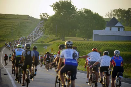 Riders roll out of Tama-Toledo, Iowa, during RAGBRAI 50, Friday, July 28, 2023. (Zach Boyden-Holmes/The Des Moines Register via AP)