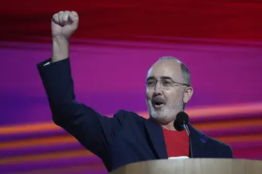 Shawn Fain, president of the United Automobile Workers, speaks during the Democratic National Convention Monday, Aug. 19, 2024, in Chicago. (AP Photo/Paul Sancya)